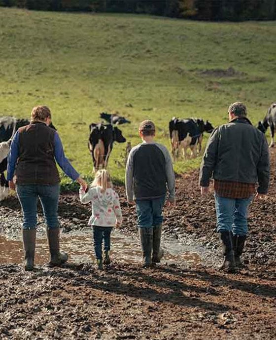Family walking on a farm path