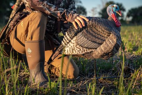 Angelique crouching near a Turkey