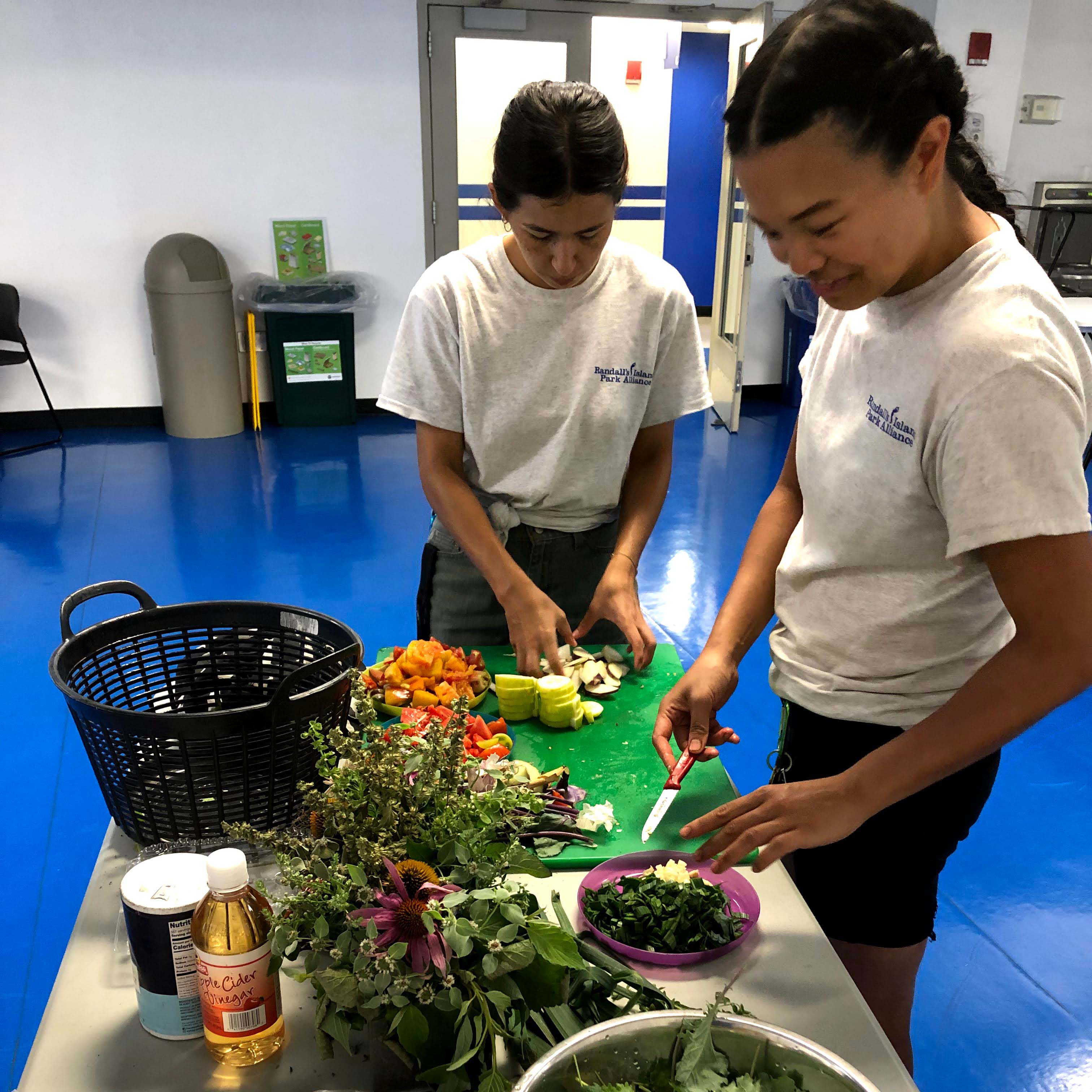 Two people working on preparing food