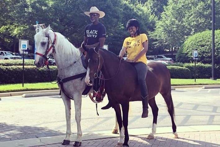 Caitlin and her Father riding horseback in a residential area