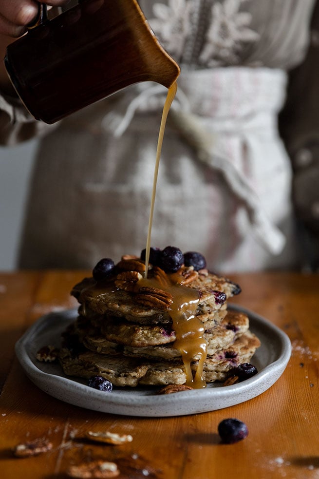 drizzling syrup on pancakes