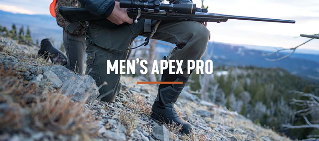 'Men's Apex Pro' Hunter kneeling cliffside with his rifle ready while wearing his Muck Apex Pro boots