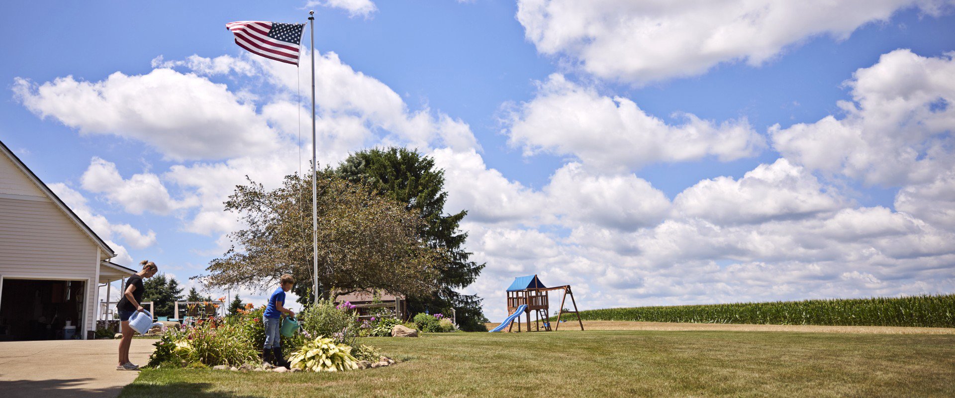 family working under american flag