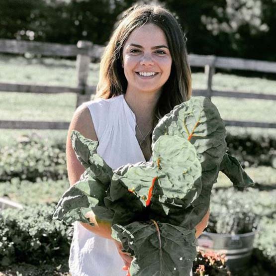 Abbagail holding vegetables